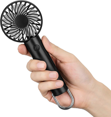 Black portable hand-held mini fan with adjustable speeds and clip held in hand